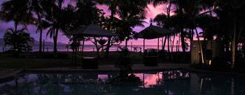 Sunset scene overlooking pool and the ocean in Fiji