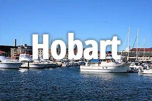 hobart-title Hobart title with boats in harbour in background