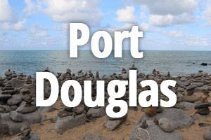 port-douglas Port Douglas title with stacked rocks on coastline in background